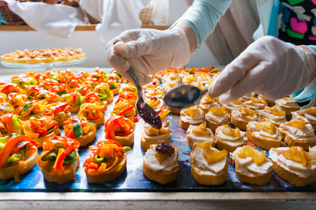 Ornating different catering food specialities for a weddingの写真素材