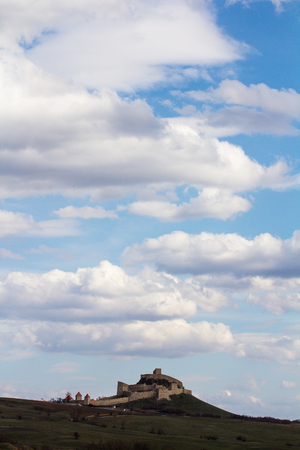 View of a fortress from Rupea, Transylvania, with its fortified walls, on a cloudy day.のeditorial素材
