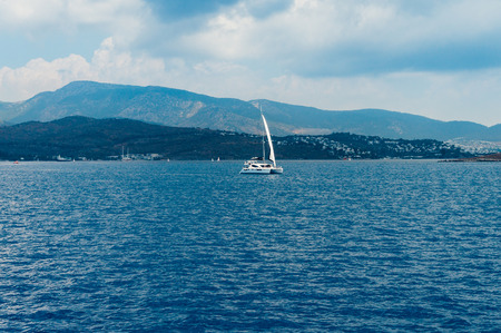 Cruising sailboat speeding at open sea in Turkeyの写真素材