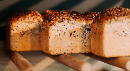 Three square bread covered in seeds