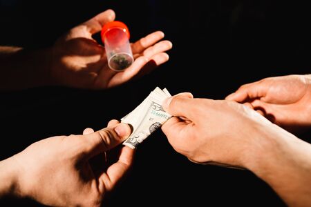 Drug dealer taking money for cocaineの写真素材