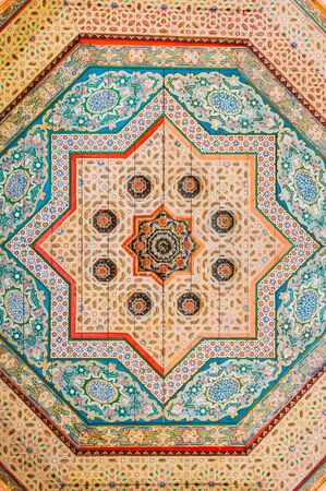 Marrakesh, Morocco - February 8, 2015: Floral pattern paintings on wood ceiling in Bahia Palace.のeditorial素材
