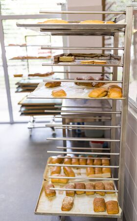 Shelf with a variety of hot bakery productsの写真素材