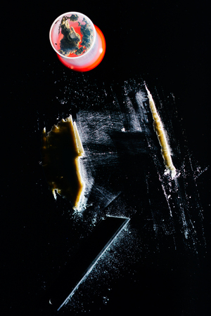 Pot of drugs and a line of cocaine cut with razor blade on mirrorの写真素材