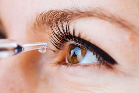Bucharest, Romania - June 18,2016 : Pose of a pipette dripping medical fluid into an eyeのeditorial素材