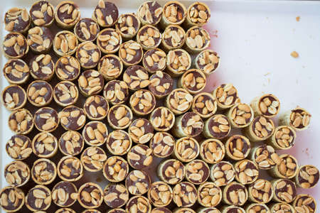 Many chocolate dessert assorted with peanuts on a plate