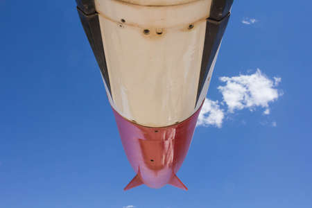 Closeup of a army spaceship's wing seen from downstairs in a sunny dayの写真素材