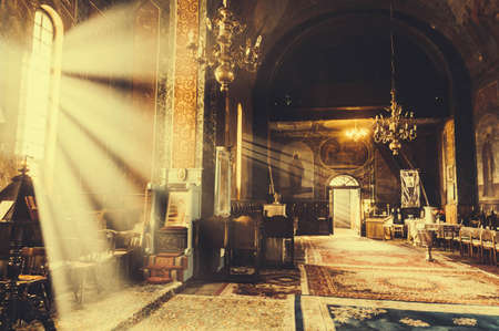 Interior of an orthodox church with sunny rays inside