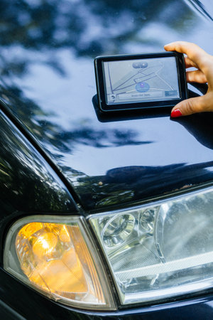 The driver has lost and now she is trying to find the good way.の写真素材