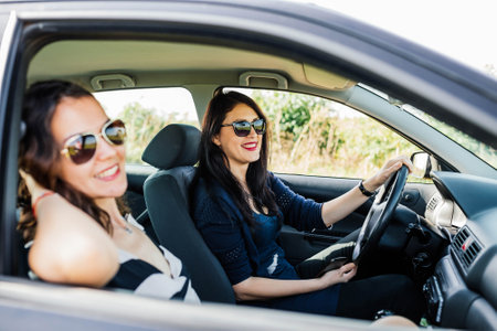 Happy family trip.The women are laughing.They are enjoying their trip.の写真素材