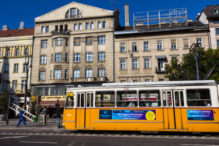 Budapest, Hungary - February 23, 2015: Stopped tram and workers in the historical center of the city.のeditorial素材