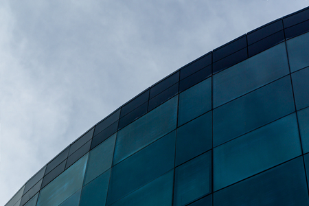 Abstract building with the sky on the background
