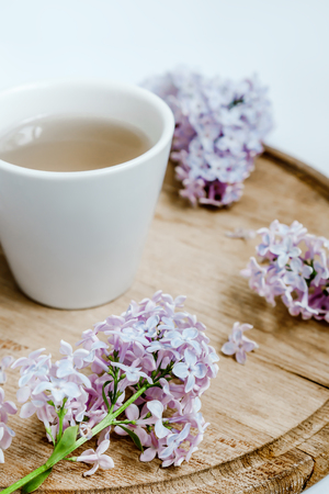 Lilac flower bouquet, wood desk, white background, morningの写真素材
