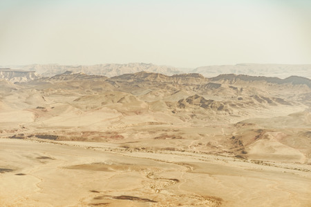 Summer travel to israel negev desert full of sand. Landscape view on crater ramon. Middle east tourismの写真素材