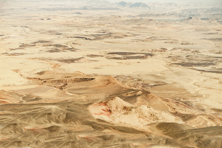 Landscape of israel negev desert. Sand background and blue summer sky. Middle east crater formationの写真素材