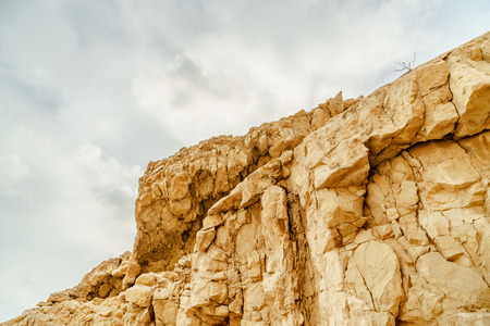 View on rock in dry desert in Israel. Valley of sand, rocks and stones in hot middle east tourism...