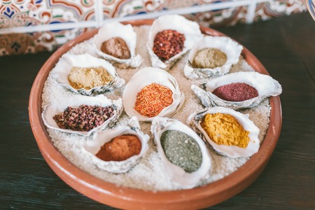 Spices in white bowls-shells.の写真素材
