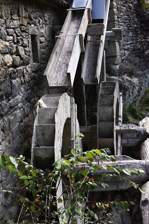 Old water mill in early autumnの写真素材