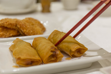 Chinese Deep Fried Spring Rolls with red chopsticks