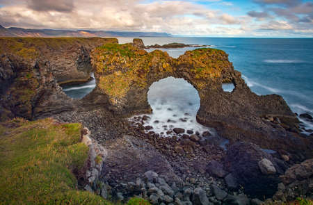 Gatklettur natural rock arch, located at Hellnar Beach on the SnÃ¦fellsnes Peninsula of Iceland.の写真素材