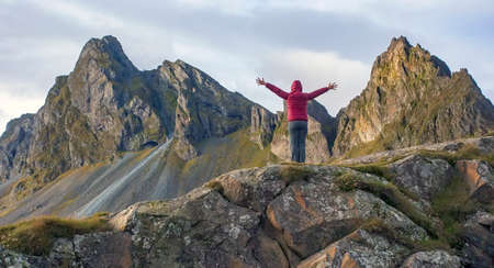 A female hiker in front of Eystrahorn mountain, Iceland.
