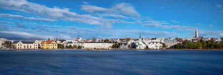 A panoramic view of colorful central Reykjavik as seen from across TjÃ¶rnin Lake.のeditorial素材