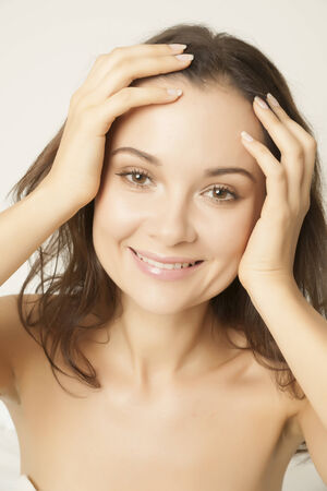 Frontal close-up of smiling young womanの写真素材