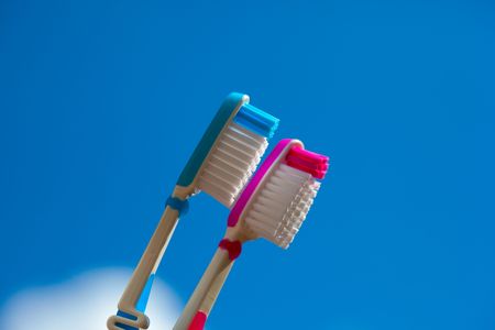 two toothbrush in detail with blue backgroundの写真素材