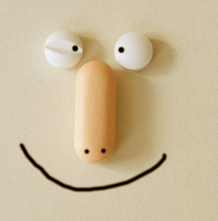 pills with a funny faceの写真素材