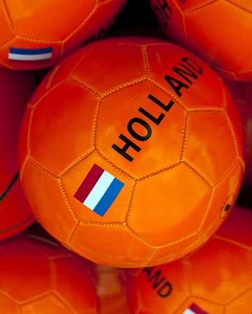 a orange soccerball with dutch flagの写真素材