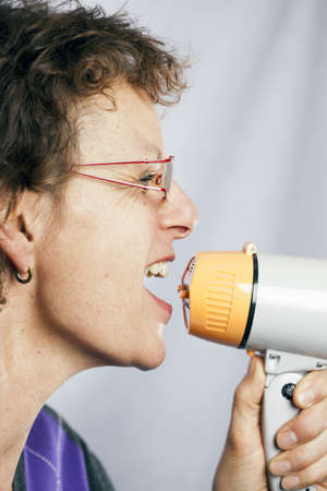 young woman shouting through a megaphone 