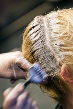 Closeup view during hair dyeing treatment ... 