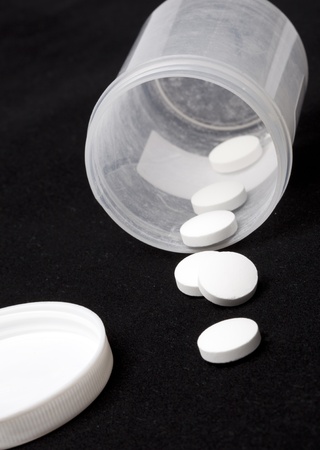 Bottle of Pills In Black Background の写真素材