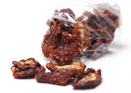 sun-dried tomatoes with olive oil, isolated on white の写真素材