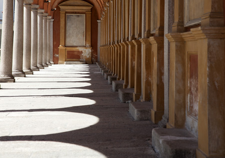 Sunlight through the arches of a corridor in a church