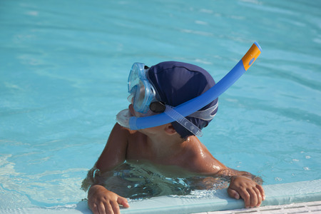 young boy in a swmming poolの写真素材