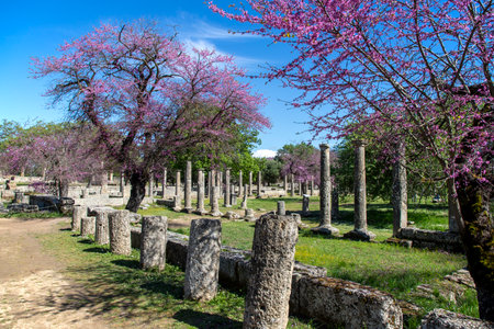 Pillars of Temple of Apollo viewed from archeological ruins down below in Ancient Corinth Greeceの写真素材