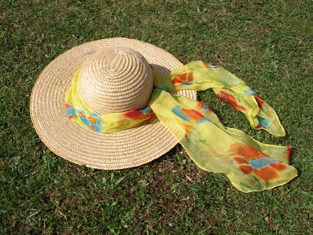 Straw hat with bright scarf (1)の写真素材