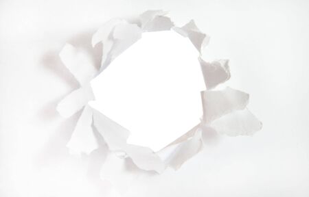 Hole on white paper isolatedの写真素材