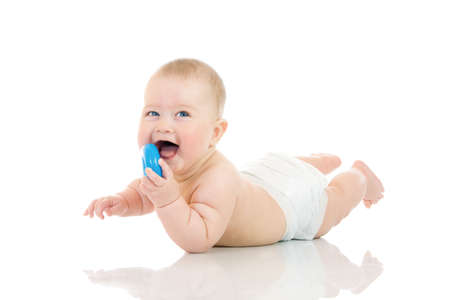 Laying small baby with a toy isolated over white