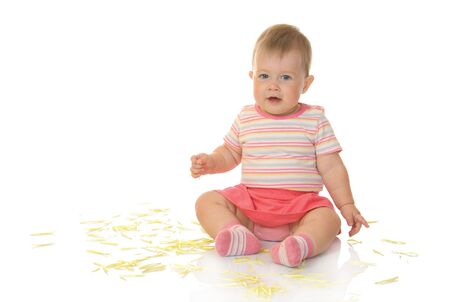 Sitting small baby with yellow petals #3 isolatedの写真素材