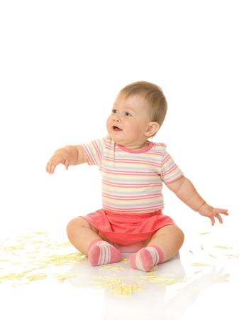 Sitting small baby with yellow petals isolatedの写真素材