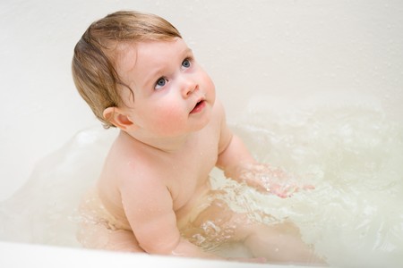 Small bathing child in a house bathroomの写真素材