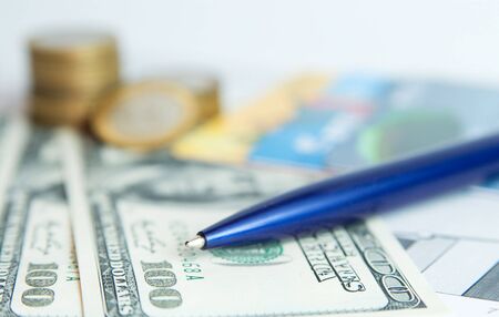 Modern business background with dollars, coins and cardsの写真素材