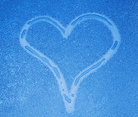 Heart sign on wet glassの写真素材