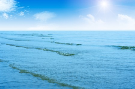 Sea waves and cloudy skiesの写真素材