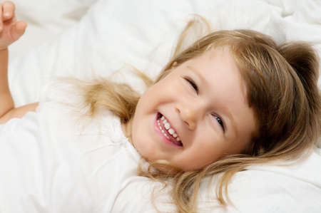 Close-up portrait of smiling little girlの写真素材