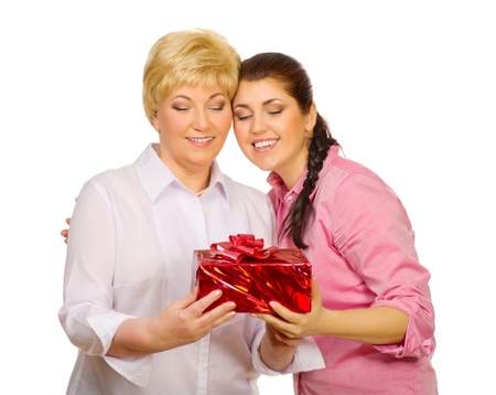 Daughter giving gift to her mother isolatedの写真素材