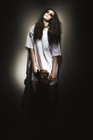 Zombie girl with teddy bear (ancient style version)の写真素材