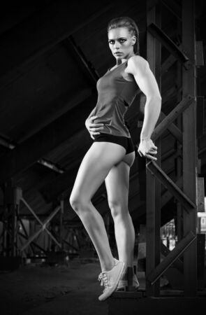 Young sporty woman in orange skirt (monochrome version)の写真素材